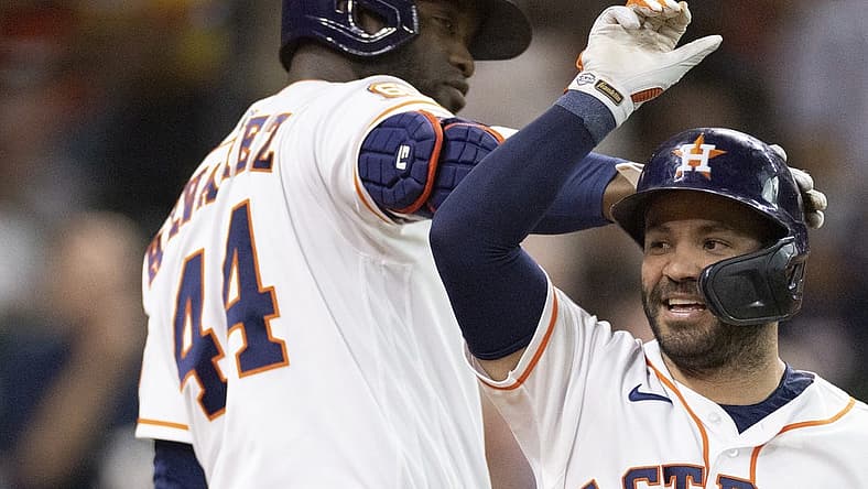 Aug 24, 2022; Houston, Texas, USA; Houston Astros designated hitter Yordan Alvarez (44) and second baseman Jose Altuve (27) celebrates his home run against the Minnesota Twins in the first inning at Minute Maid Park. Mandatory Credit: Thomas Shea-USA TODAY Sports