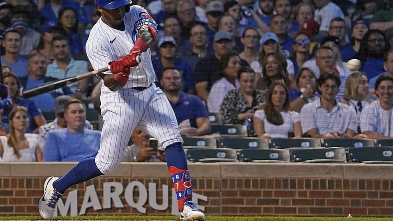 Aug 24, 2022; Chicago, Illinois, USA; Chicago Cubs right fielder Nelson Velazquez (4) hits a double against the St. Louis Cardinals during the second inning at Wrigley Field. Mandatory Credit: David Banks-USA TODAY Sports