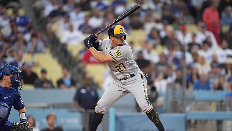 Aug 22, 2022; Los Angeles, California, USA; Milwaukee Brewers shortstop Willy Adames (27) bats against the Los Angeles Dodgers at Dodger Stadium. Mandatory Credit: Kirby Lee-USA TODAY Sports