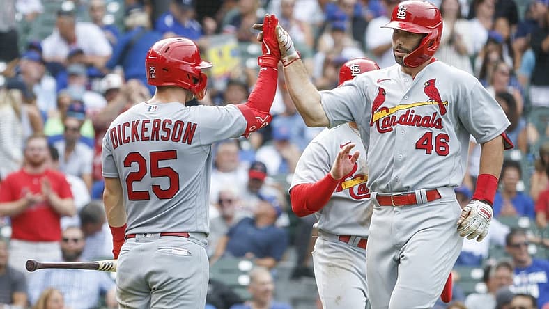 Aug 25, 2022; Chicago, Illinois, USA; St. Louis Cardinals first baseman Paul Goldschmidt (46) celebrates with left fielder Corey Dickerson (25) after hitting a two-run home run against the Chicago Cubs during the eight inning at Wrigley Field. Mandatory Credit: Kamil Krzaczynski-USA TODAY Sports