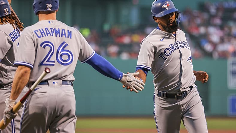 Aug 25, 2022; Boston, Massachusetts, USA; Toronto Blue Jays right fielder Teoscar Hernandez (37) celebrates with Toronto Blue Jays third baseman Matt Chapman (26) after scoring during the first inning against the Boston Red Sox at Fenway Park. Mandatory Credit: Paul Rutherford-USA TODAY Sports
