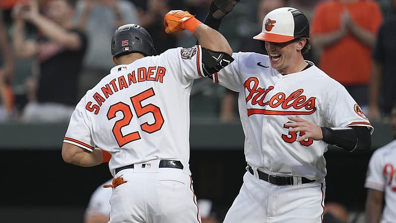Aug 25, 2022; Baltimore, Maryland, USA; Baltimore Orioles designated hitter Anthony Santander (25) celebrates a home run against the Chicago White Sox with catcher Adley Rutschman (35) during the first inning at Oriole Park at Camden Yards. Mandatory Credit: Jessica Rapfogel-USA TODAY Sports