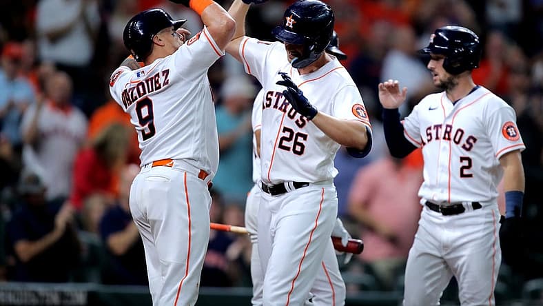 Aug 25, 2022; Houston, Texas, USA; Houston Astros designated hitter Trey Mancini (26) celebrates with Houston Astros catcher Christian Vazquez (9) after hitting a three-run home run against the Minnesota Twins during the first inning at Minute Maid Park. Mandatory Credit: Erik Williams-USA TODAY Sports
