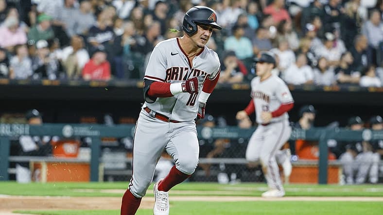 Aug 26, 2022; Chicago, Illinois, USA; Arizona Diamondbacks third baseman Josh Rojas (10) runs to second base after hitting a three-run double against the Chicago White Sox during the second inning at Guaranteed Rate Field. Mandatory Credit: Kamil Krzaczynski-USA TODAY Sports