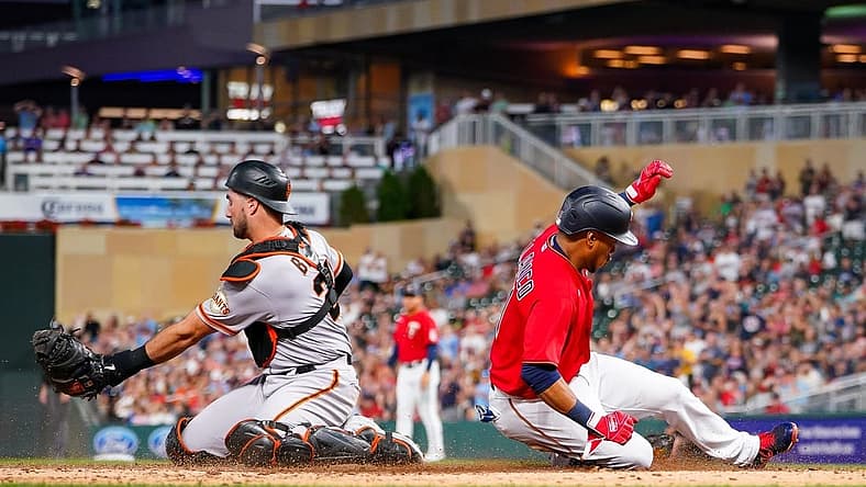 Aug 26, 2022; Minneapolis, Minnesota, USA; Minnesota Twins second baseman Jorge Polanco (11) slides home against the San Francisco Giants in the third inning at Target Field. Mandatory Credit: Brad Rempel-USA TODAY Sports