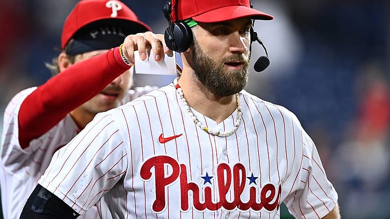 Aug 26, 2022; Philadelphia, Pennsylvania, USA; Philadelphia Phillies outfielder Bryce Harper (3) reacts as infielder Bryson Stott (5) dumps water after the game against the Pittsburgh Pirates at Citizens Bank Park. Mandatory Credit: Kyle Ross-USA TODAY Sports