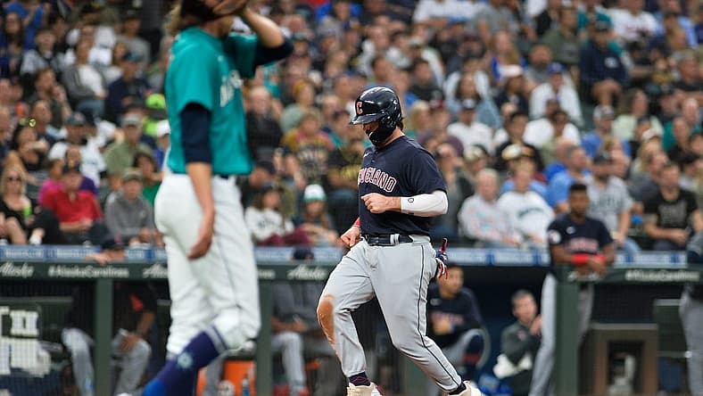 Aug 26, 2022; Seattle, Washington, USA; Cleveland Guardians catcher Austin Hedges (17) scores a run off a sacrifice fly ball hit by left fielder Steven Kwan (38) (not pictured) during the third inning against the Seattle Mariners at T-Mobile Park. Mandatory Credit: Steven Bisig-USA TODAY Sports