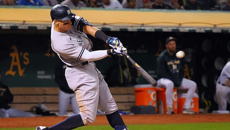Aug 26, 2022; Oakland, California, USA; New York Yankees center fielder Aaron Judge (99) hits a three-run home run against the Oakland Athletics during the fifth inning at RingCentral Coliseum. Mandatory Credit: Kelley L Cox-USA TODAY Sports