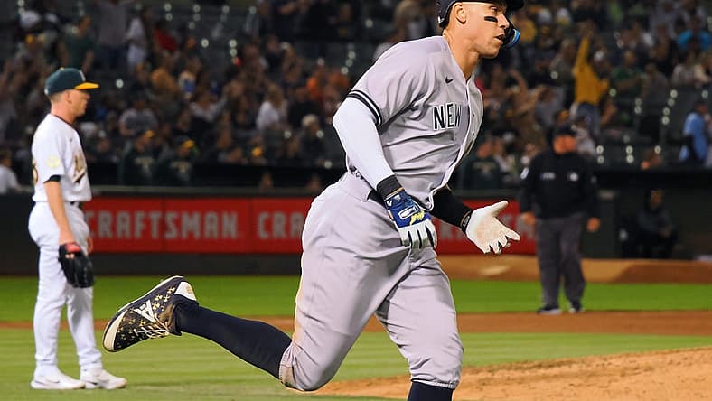 Aug 26, 2022; Oakland, California, USA; New York Yankees center fielder Aaron Judge (99) rounds the bases after hitting three-run home run off Oakland Athletics starting pitcher JP Sears (38) during the fifth inning at RingCentral Coliseum. Mandatory Credit: Kelley L Cox-USA TODAY Sports