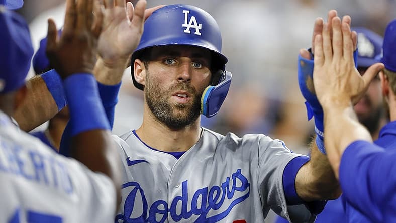 Aug 26, 2022; Miami, Florida, USA; Los Angeles Dodgers second baseman Chris Taylor (3) celebrates after scoring during the tenth inning against the Miami Marlins at loanDepot Park. Mandatory Credit: Sam Navarro-USA TODAY Sports