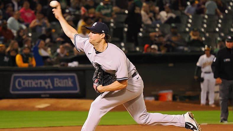 Aug 26, 2022; Oakland, California, USA; New York Yankees starting pitcher Gerrit Cole (45) throws a pitch against the Oakland Athletics during the seventh inning at RingCentral Coliseum. Mandatory Credit: Kelley L Cox-USA TODAY Sports