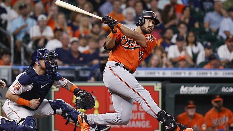 Aug 27, 2022; Houston, Texas, USA; Baltimore Orioles left fielder Anthony Santander (25) hits a home run during the third inning against the Houston Astros at Minute Maid Park. Mandatory Credit: Troy Taormina-USA TODAY Sports