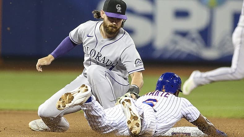 Aug 27, 2022; New York City, New York, USA;  Colorado Rockies second baseman Brendan Rodgers (7) tags out New York Mets right fielder Starling Marte (6) in the third inning at Citi Field. Mandatory Credit: Wendell Cruz-USA TODAY Sports