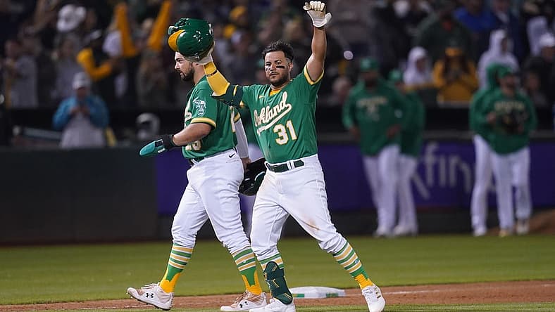 Aug 27, 2022; Oakland, California, USA; Oakland Athletics third baseman Vimael Machin (31) celebrates after defeating the New York Yankees in eleven innings at RingCentral Coliseum. Mandatory Credit: Cary Edmondson-USA TODAY Sports