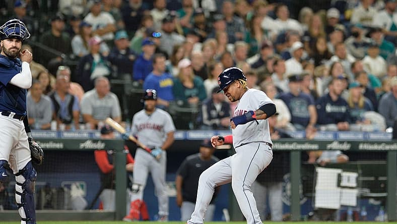 Aug 27, 2022; Seattle, Washington, USA; Cleveland Guardians third baseman Jose Ramirez (11) scores a run on a sacrifice fly hit by second baseman Andres Gimenez (not pictured) against the Seattle Mariners during the eighth inning at T-Mobile Park. Mandatory Credit: Steven Bisig-USA TODAY Sports