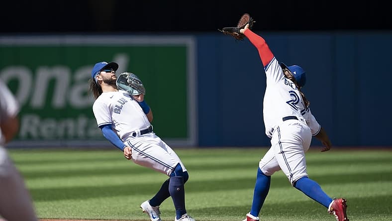 Aug 28, 2022; Toronto, Ontario, CAN; Toronto Blue Jays first baseman Vladimir Guerrero Jr. (27) catches a fly ball against the Los Angeles Angels during the third inning at Rogers Centre. Mandatory Credit: Nick Turchiaro-USA TODAY Sports