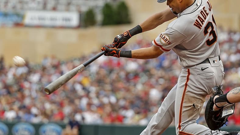 Aug 28, 2022; Minneapolis, Minnesota, USA; San Francisco Giants right fielder LaMonte Wade (31) hits an RBI ground-rule double against the Minnesota Twins in the third inning at Target Field. Mandatory Credit: Bruce Kluckhohn-USA TODAY Sports
