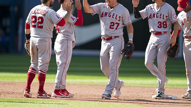 Aug 28, 2022; Toronto, Ontario, CAN; Los Angeles Angels center fielder Mike Trout (27) celebrates the win with Los Angeles Angels second baseman David Fletcher (22) against the Toronto Blue Jays at Rogers Centre. Mandatory Credit: Nick Turchiaro-USA TODAY Sports