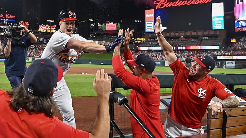 Aug 28, 2022; St. Louis, Missouri, USA; St. Louis Cardinals left fielder Tyler O'Neill (27) celebrates with manager Oliver Marmol (37) bench coach Skip Schumaker (55) and hitting coach Jeff Albert (54) after hitting a go ahead three run home run against the Atlanta Braves during the eighth inning at Busch Stadium. Mandatory Credit: Jeff Curry-USA TODAY Sports