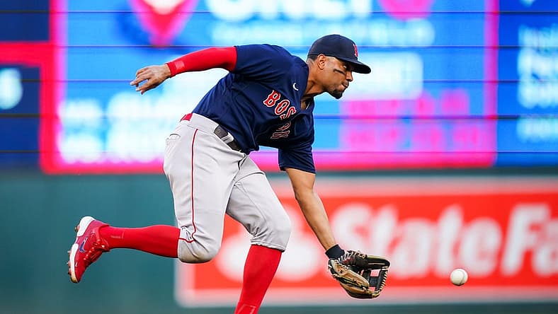 Aug 29, 2022; Minneapolis, Minnesota, USA; Boston Red Sox shortstop Xander Bogaerts (2) fields a ground ball against the Minnesota Twins in the second inning at Target Field. Mandatory Credit: Brad Rempel-USA TODAY Sports