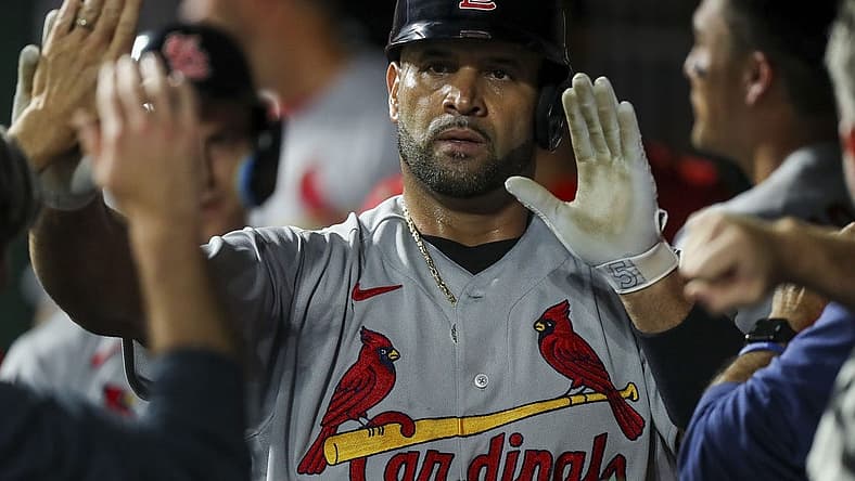 Aug 29, 2022; Cincinnati, Ohio, USA; St. Louis Cardinals first baseman Albert Pujols (5) high fives teammates after hitting a two-run home run against the Cincinnati Reds in the third inning at Great American Ball Park. Mandatory Credit: Katie Stratman-USA TODAY Sports