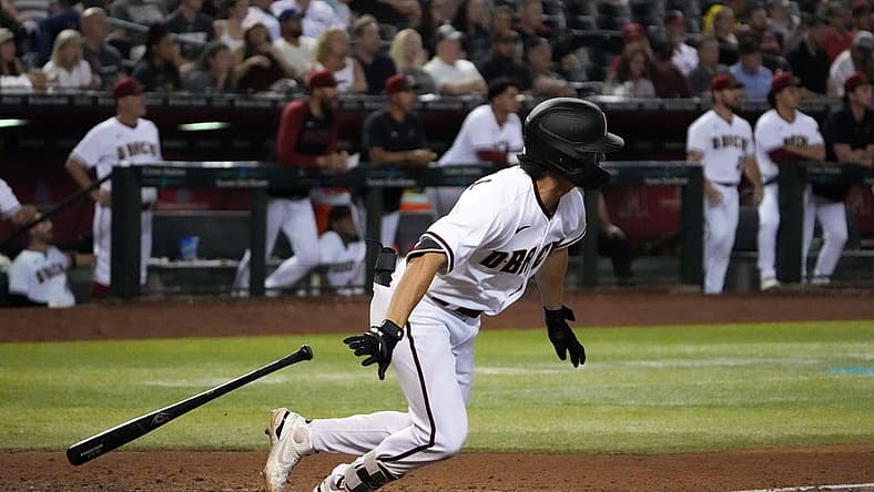 Aug 29, 2022; Phoenix, Arizona, USA; Arizona Diamondbacks right fielder Corbin Carroll (7) hits a two RBI double against the Philadelphia Phillies during the fifth inning at Chase Field. Mandatory Credit: Joe Camporeale-USA TODAY Sports