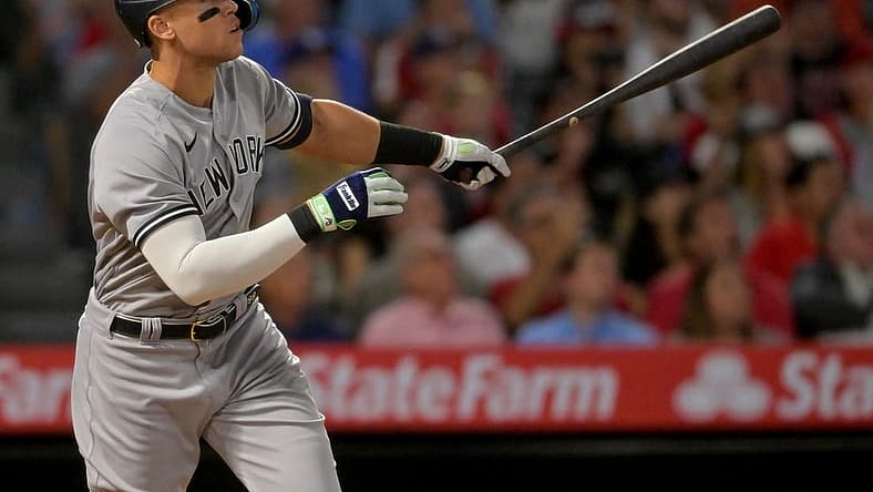Aug 29, 2022; Anaheim, California, USA; New York Yankees right fielder Aaron Judge (99) watches the flight of the ball on his 50th home run of the season in the eighth inning against the Los Angeles Angels at Angel Stadium. Mandatory Credit: Jayne Kamin-Oncea-USA TODAY Sports