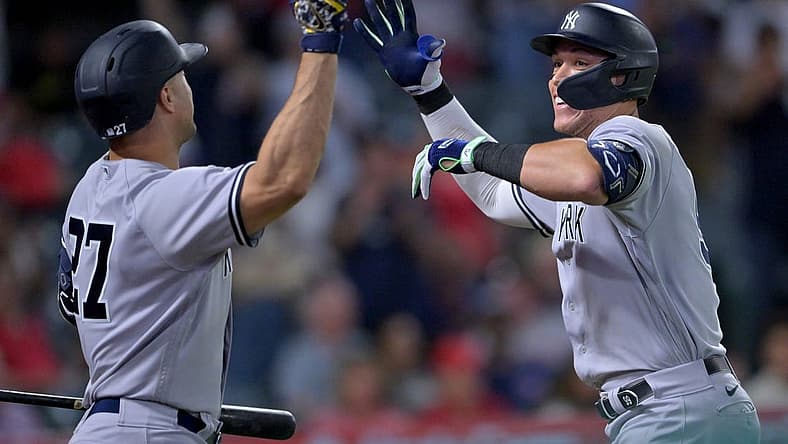 Aug 29, 2022; Anaheim, California, USA; New York Yankees right fielder Aaron Judge (99) is congratulated by designated hitter Giancarlo Stanton (27) after hitting his 50th home run of the season in the eighth inning against the Los Angeles Angels at Angel Stadium. Mandatory Credit: Jayne Kamin-Oncea-USA TODAY Sports