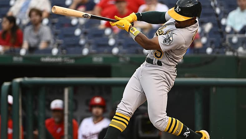 Aug 30, 2022; Washington, District of Columbia, USA; Oakland Athletics left field Tony Kemp (5) hits a double against the Washington Nationals during the first inning at Nationals Park. Mandatory Credit: Brad Mills-USA TODAY Sports