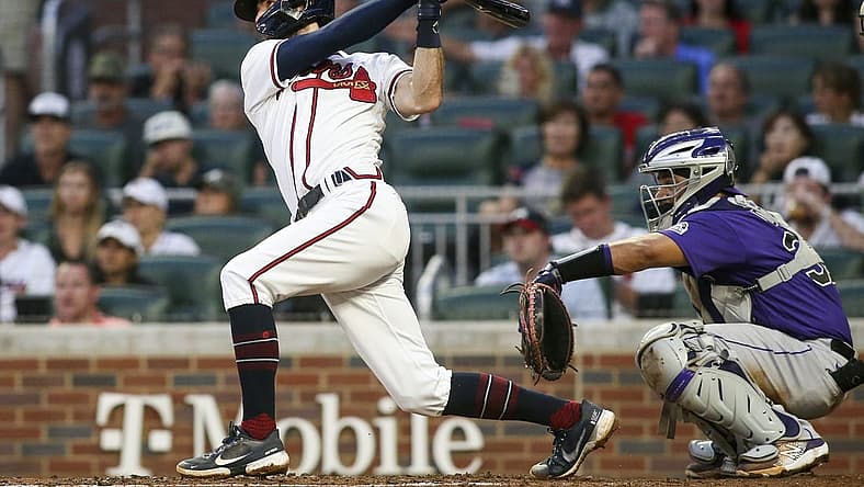 Aug 30, 2022; Atlanta, Georgia, USA; Atlanta Braves shortstop Dansby Swanson (7) hits an RBI double against the Colorado Rockies in the second inning at Truist Park. Mandatory Credit: Brett Davis-USA TODAY Sports