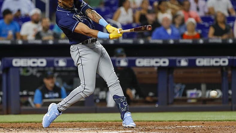Aug 30, 2022; Miami, Florida, USA; Tampa Bay Rays center fielder Jose Siri (22) hits a single during the fifth inning against the Miami Marlins at loanDepot Park. Mandatory Credit: Sam Navarro-USA TODAY Sports