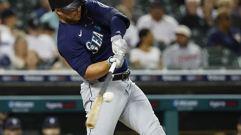 Aug 30, 2022; Detroit, Michigan, USA; Seattle Mariners first baseman Ty France (23) hits a single in the fifth inning against the Detroit Tigers at Comerica Park. Mandatory Credit: Rick Osentoski-USA TODAY Sports