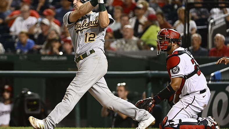 Aug 30, 2022; Washington, District of Columbia, USA; Oakland Athletics catcher Sean Murphy (12) hits a grand slam against the Washington Nationals during the fifth inning at Nationals Park. Mandatory Credit: Brad Mills-USA TODAY Sports