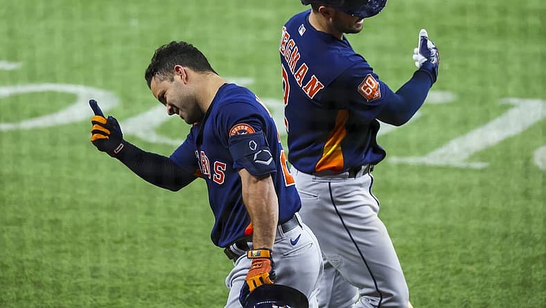 Aug 30, 2022; Arlington, Texas, USA; Houston Astros second baseman Jose Altuve (27) celebrates with Houston Astros third baseman Alex Bregman (2) after hitting a home run during the third inning against the Texas Rangers at Globe Life Field. Mandatory Credit: Kevin Jairaj-USA TODAY Sports