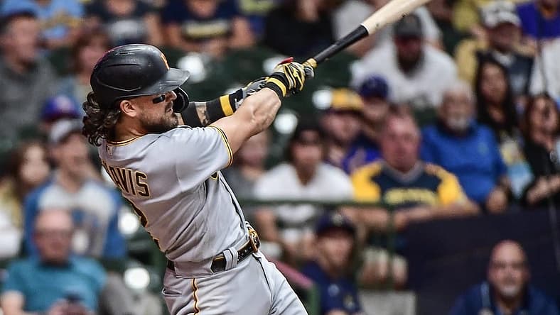 Aug 30, 2022; Milwaukee, Wisconsin, USA; Pittsburgh Pirates first baseman Michael Chavis (2) hits a solo home run in the seventh inning against the Milwaukee Brewers at American Family Field. Mandatory Credit: Benny Sieu-USA TODAY Sports