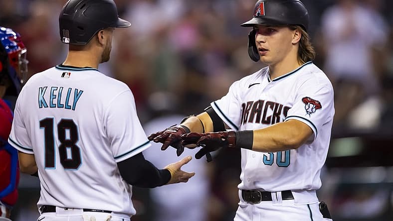 Aug 30, 2022; Phoenix, Arizona, USA; Arizona Diamondbacks outfielder Jake McCarthy (right) celebrates with teammate Carson Kelly after hitting a three run home run in the fourth inning against the Philadelphia Phillies at Chase Field. Mandatory Credit: Mark J. Rebilas-USA TODAY Sports