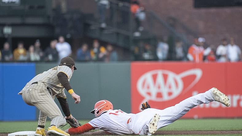 Aug 30, 2022; San Francisco, California, USA; San Diego Padres second baseman Jake Cronenworth (left) tags out San Francisco Giants center fielder Austin Slater (13) at second base during the first inning at Oracle Park. Mandatory Credit: Ed Szczepanski-USA TODAY Sports