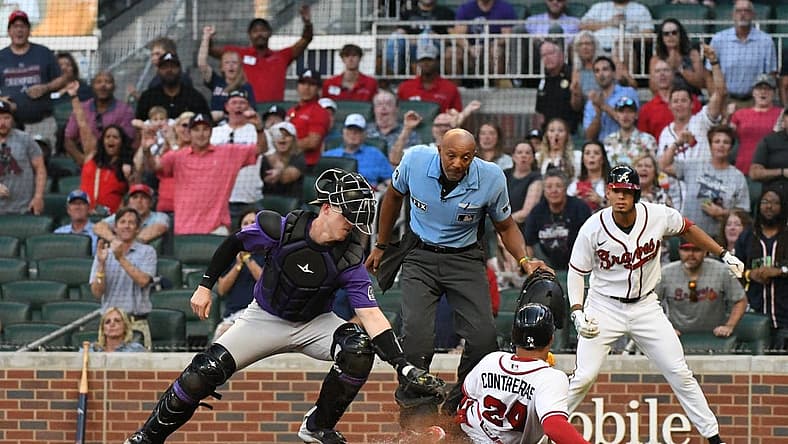 Aug 31, 2022; Cumberland, Georgia, USA; Atlanta Braves catcher William Contreras (24) gets thrown at home in the first inning against the Colorado Rockies at Truist Park. Mandatory Credit: Larry Robinson-USA TODAY Sports