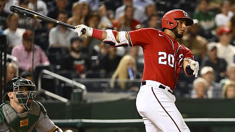 Aug 31, 2022; Washington, District of Columbia, USA; Washington Nationals catcher Keibert Ruiz (20) hits a single against the Oakland Athletics during the fourth inning at Nationals Park. Mandatory Credit: Brad Mills-USA TODAY Sports