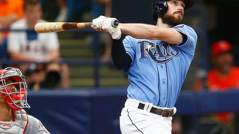 Jun 27, 2021; St. Petersburg, Florida, USA;  Tampa Bay Rays second baseman Brandon Lowe (8) hits a home run in the fifth inning during a game against the Los Angeles Angels at Tropicana Field. Mandatory Credit: Nathan Ray Seebeck-USA TODAY Sports