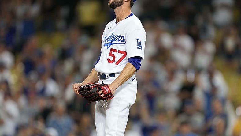 Jul 10, 2021; Los Angeles, California, USA; Los Angeles Dodgers relief pitcher Jake Reed (57) celebrates after defeating the Arizona Diamondback sat Dodger Stadium. Mandatory Credit: Kirby Lee-USA TODAY Sports