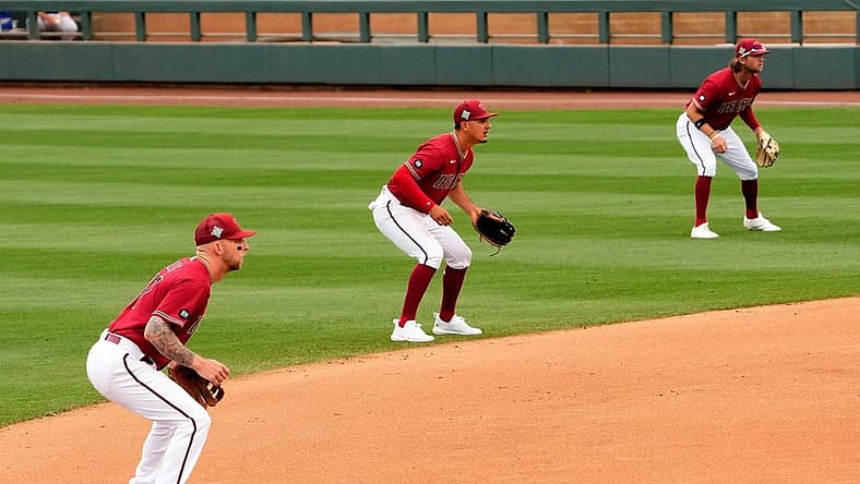 Arizona Diamondbacks infielders Drew Ellis, Josh Rojas, and Jake Hager shift to the right side of second base against the Los Angeles Dodgers in the fourth inning during a spring training game at Salt River Fields.
Baseball Los Angeles Dodgers At Arizona Diamondbacks