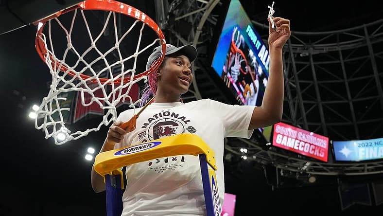 Apr 3, 2022; Minneapolis, MN, USA; South Carolina Gamecocks forward Aliyah Boston (4) cuts the nets as she celebrates their 64-49 victory over the UConn Huskies in the Final Four championship game of the women's college basketball NCAA Tournament at Target Center. Mandatory Credit: Kirby Lee-USA TODAY Sports
