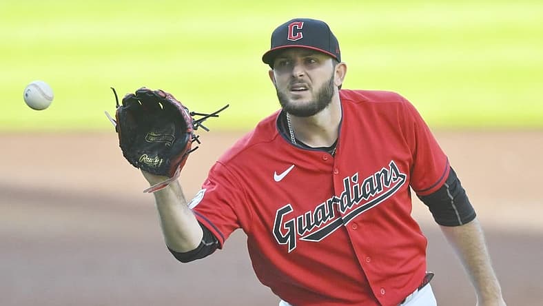 Jun 9, 2022; Cleveland, Ohio, USA; Cleveland Guardians starting pitcher Konnor Pilkington (45) catches a new ball after giving up a home run in the second inning against the Oakland Athletics at Progressive Field. Mandatory Credit: David Richard-USA TODAY Sports