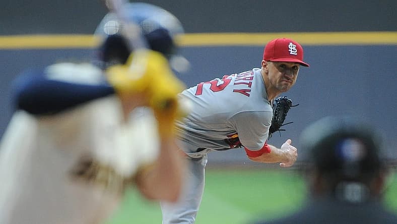 Jun 21, 2022; Milwaukee, Wisconsin, USA;  St. Louis Cardinals starting pitcher Jack Flaherty (22) gives up a home run to Milwaukee Brewers shortstop Willy Adames (27) in the first inning at American Family Field. Mandatory Credit: Michael McLoone-USA TODAY Sports