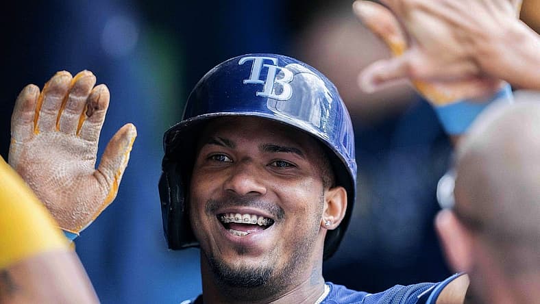 Jul 2, 2022; Toronto, Ontario, CAN; Tampa Bay Rays shortstop Wander Franco (5) celebrates in the dugout after hitting a home run against the Toronto Blue Jays during the sixth inning at Rogers Centre. Mandatory Credit: Nick Turchiaro-USA TODAY Sports