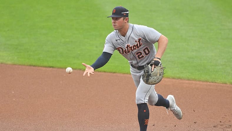 Jul 16, 2022; Cleveland, Ohio, USA; Detroit Tigers first baseman Spencer Torkelson (20) tosses the ball to first base in the first inning against the Cleveland Guardians at Progressive Field. Mandatory Credit: David Richard-USA TODAY Sports