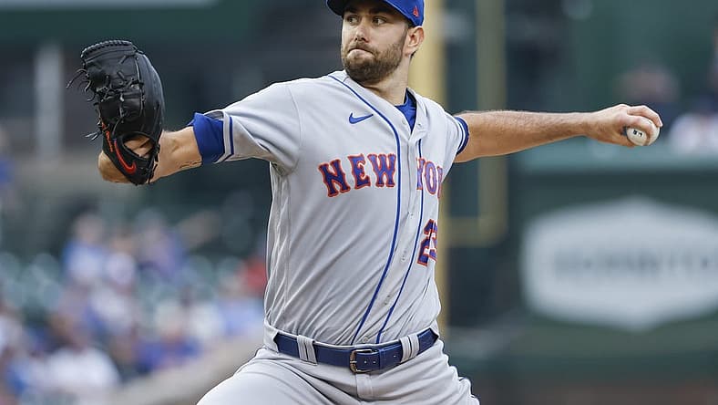 Jul 17, 2022; Chicago, Illinois, USA; New York Mets starting pitcher David Peterson (23) delivers against the Chicago Cubs during the first inning at Wrigley Field. Mandatory Credit: Kamil Krzaczynski-USA TODAY Sports