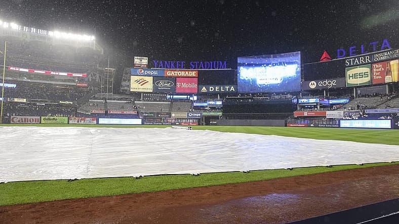 Jul 29, 2022; Bronx, New York, USA; A rain delay is called in the game between the Kansas City Royals and the New York Yankees after the bottom of the seventh inning at Yankee Stadium. Mandatory Credit: Wendell Cruz-USA TODAY Sports