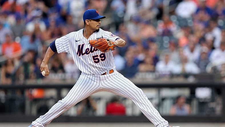 Aug 4, 2022; New York City, New York, USA; New York Mets starting pitcher Carlos Carrasco (59) pitches against the Atlanta Braves during the first inning at Citi Field. Mandatory Credit: Brad Penner-USA TODAY Sports